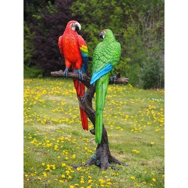 Blauwe & rode papegaai op boomstam